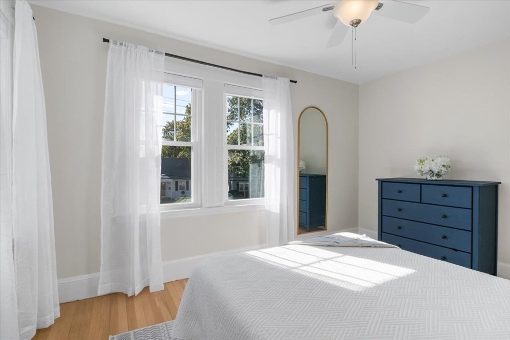 35 Clinton Road Weymouth, MA 02189 - Photo 24 of 37 a bedroom with a bed and a dresser