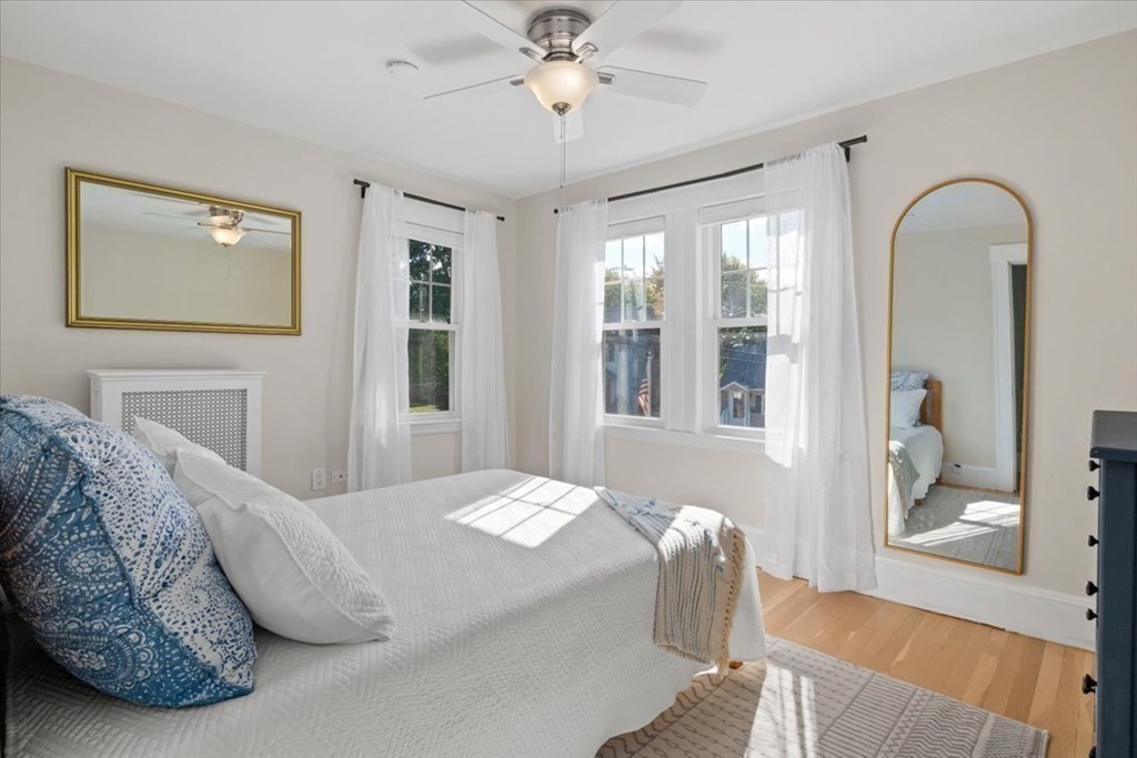 35 Clinton Road Weymouth, MA 02189 - Photo 25 of 37 a bedroom with a bed and dresser with mirror