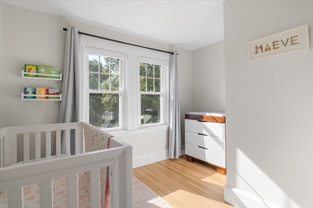 35 Clinton Road Weymouth, MA 02189 - Photo 27 of 37 a view of a bedroom with baby bed and a window