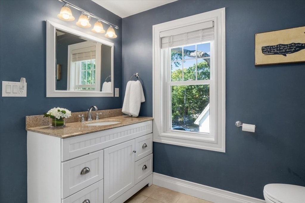 35 Clinton Road Weymouth, MA 02189 - Photo 28 of 37 a bathroom with a granite countertop sink toilet and mirror