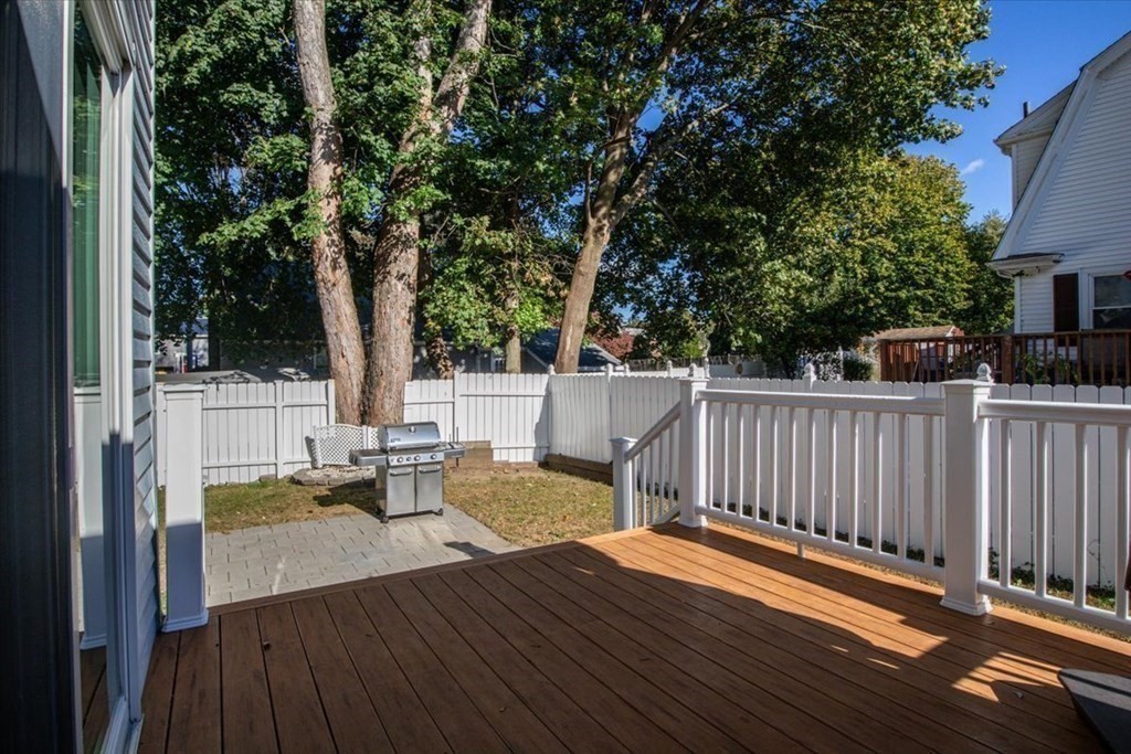 35 Clinton Road Weymouth, MA 02189 - Photo 30 of 37 a view of a patio with table and chairs and wooden floor