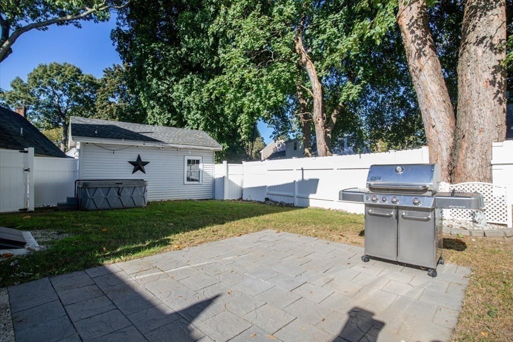 35 Clinton Road Weymouth, MA 02189 - Photo 32 of 37 a view of backyard of house with outdoor seating and green space