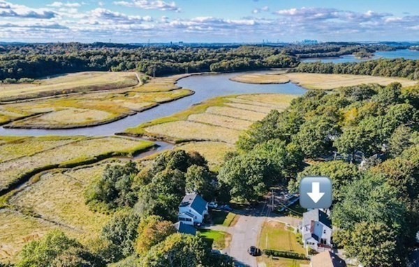 35 Clinton Road Weymouth, MA 02189 - Photo 35 of 37 a view of a lake with a mountain in the background