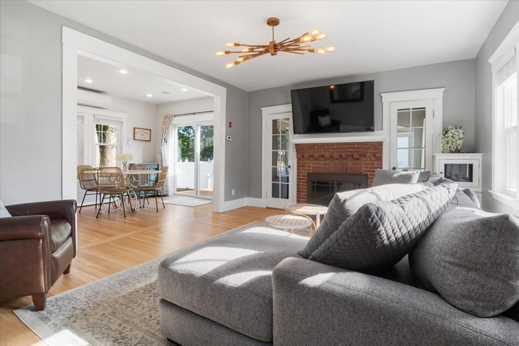 35 Clinton Road Weymouth, MA 02189 - Photo 6 of 37 a living room with furniture fireplace and flat screen tv