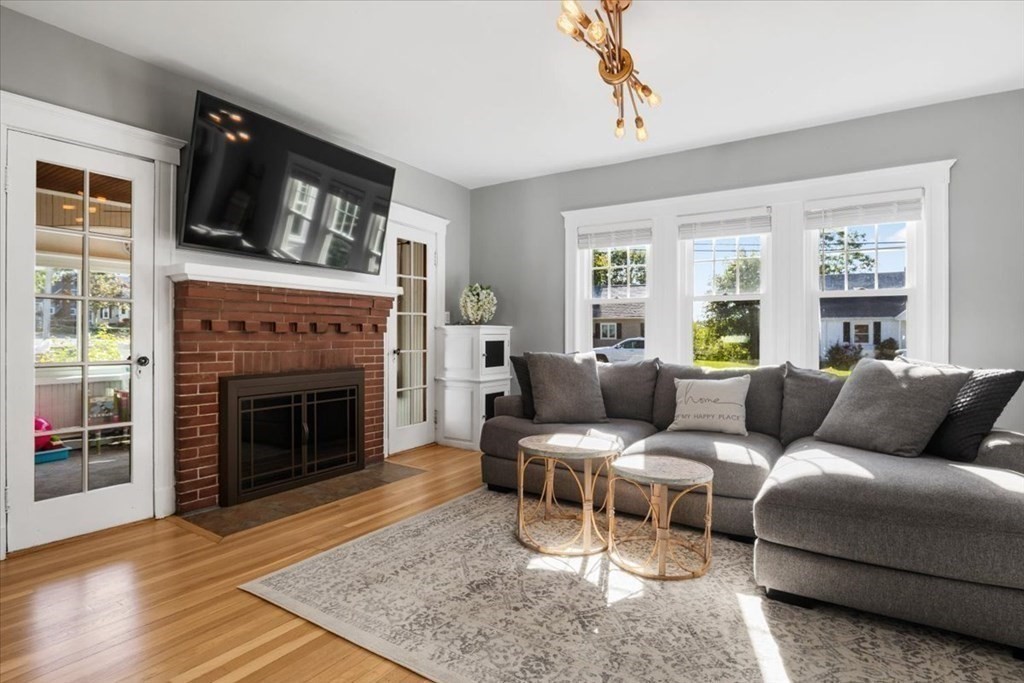 35 Clinton Road Weymouth, MA 02189 - Photo 7 of 37 a living room with furniture and a fireplace