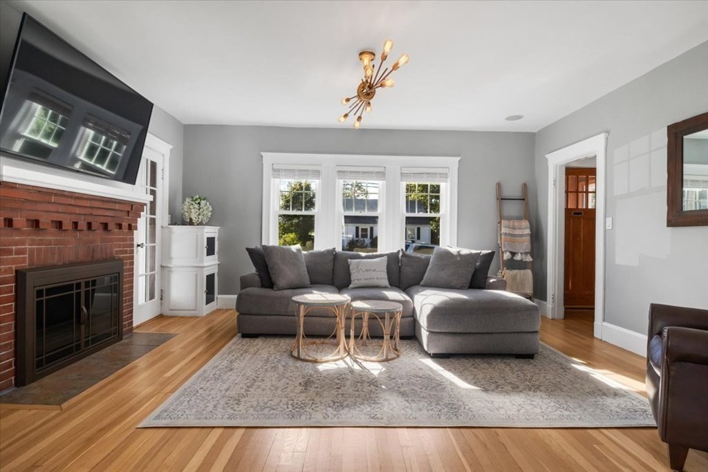 35 Clinton Road Weymouth, MA 02189 - Photo 9 of 37 a living room with furniture and a fireplace
