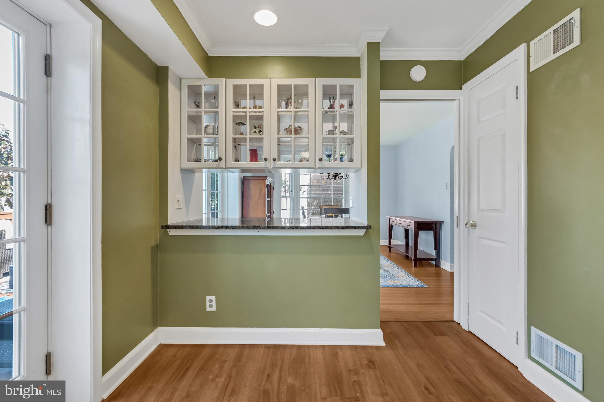 117 Dewey Road Cheltenham, PA 19012 - Photo 5 of 27 Kitchen with built in cabinets to dining room