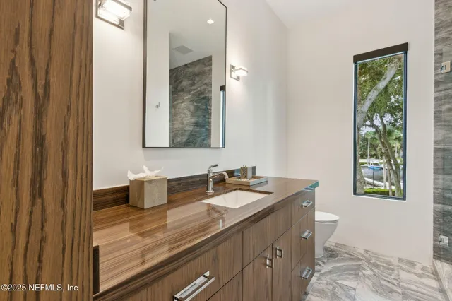a view of a swimming pool with a table and chairs