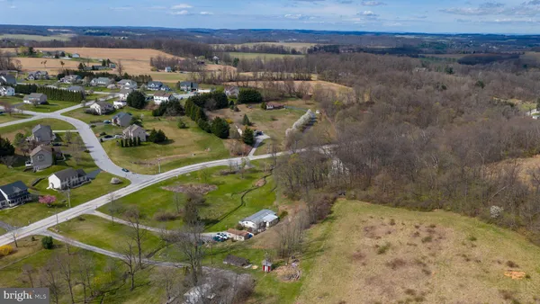 a aerial view of a house with a yard