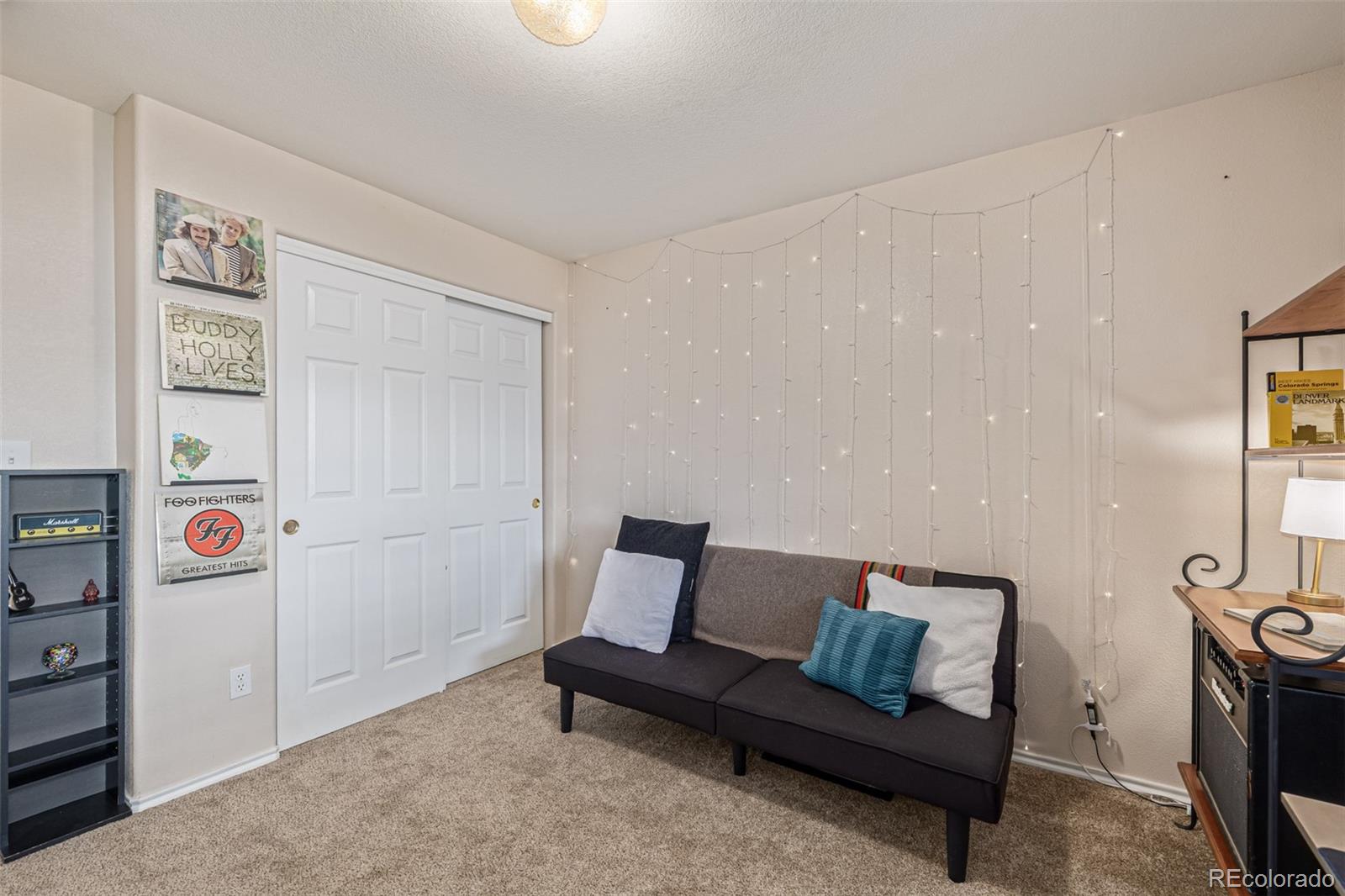 3976 Riviera Grove, Unit 203 Colorado Springs, CO 80922 - Photo 14 of 22 a living room with furniture and a wooden floor