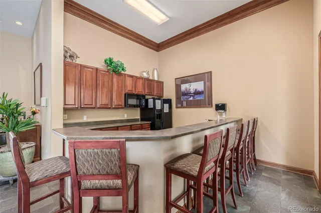 a kitchen with a table and chairs in it