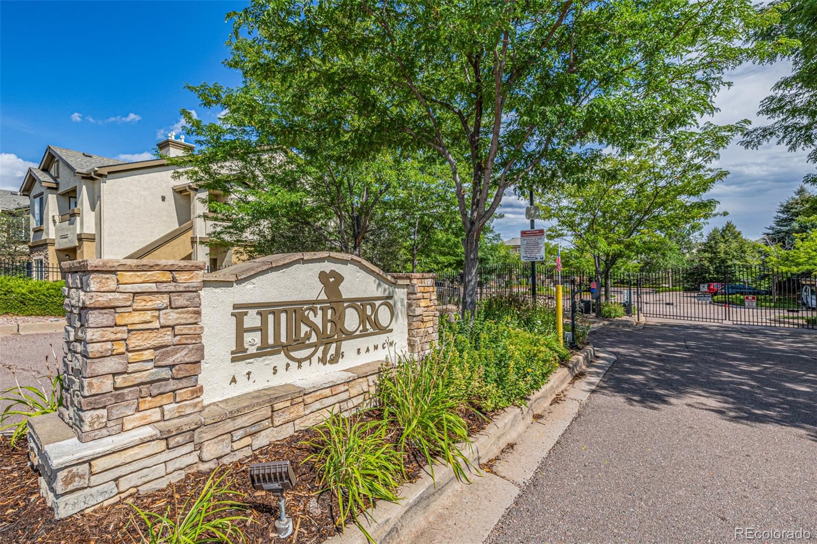 3976 Riviera Grove, Unit 203 Colorado Springs, CO 80922 - Photo 22 of 22 a view of a street with sign board