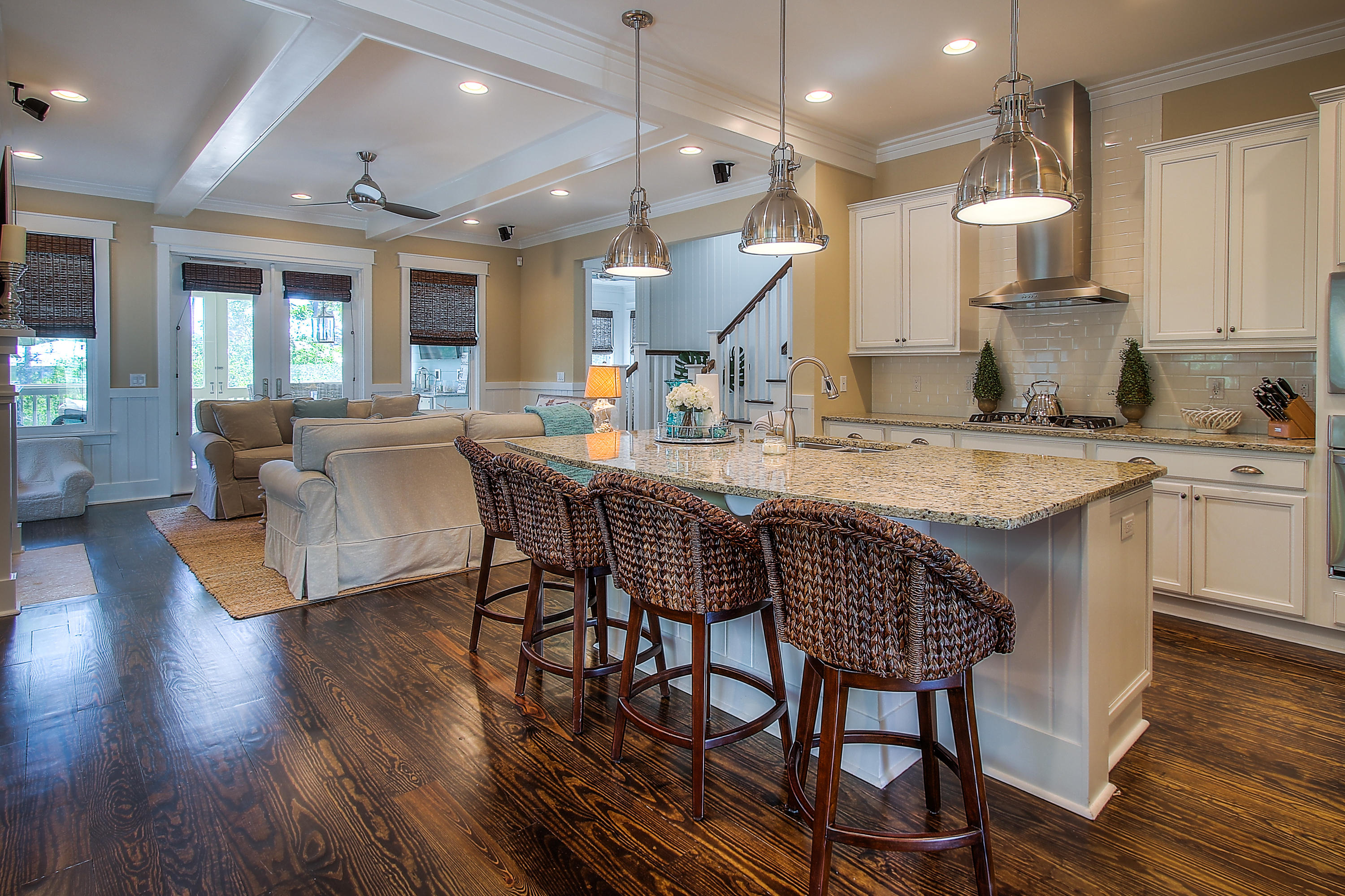65 Flatwoods Forest Loop Santa Rosa Beach, FL 32459 - Photo 11 of 51 a kitchen with stainless steel appliances granite countertop a kitchen island a stove a table and chairs in it