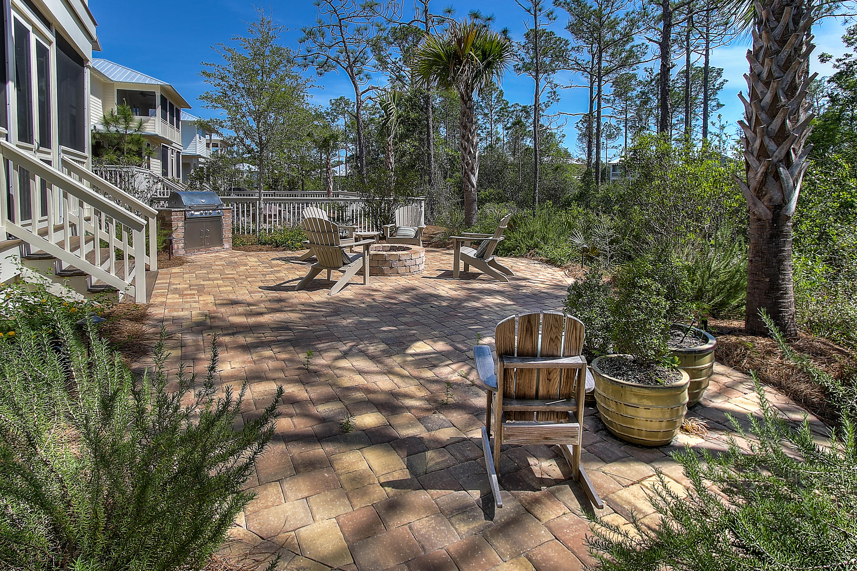 65 Flatwoods Forest Loop Santa Rosa Beach, FL 32459 - Photo 23 of 51 a view of a chairs and table in the patio