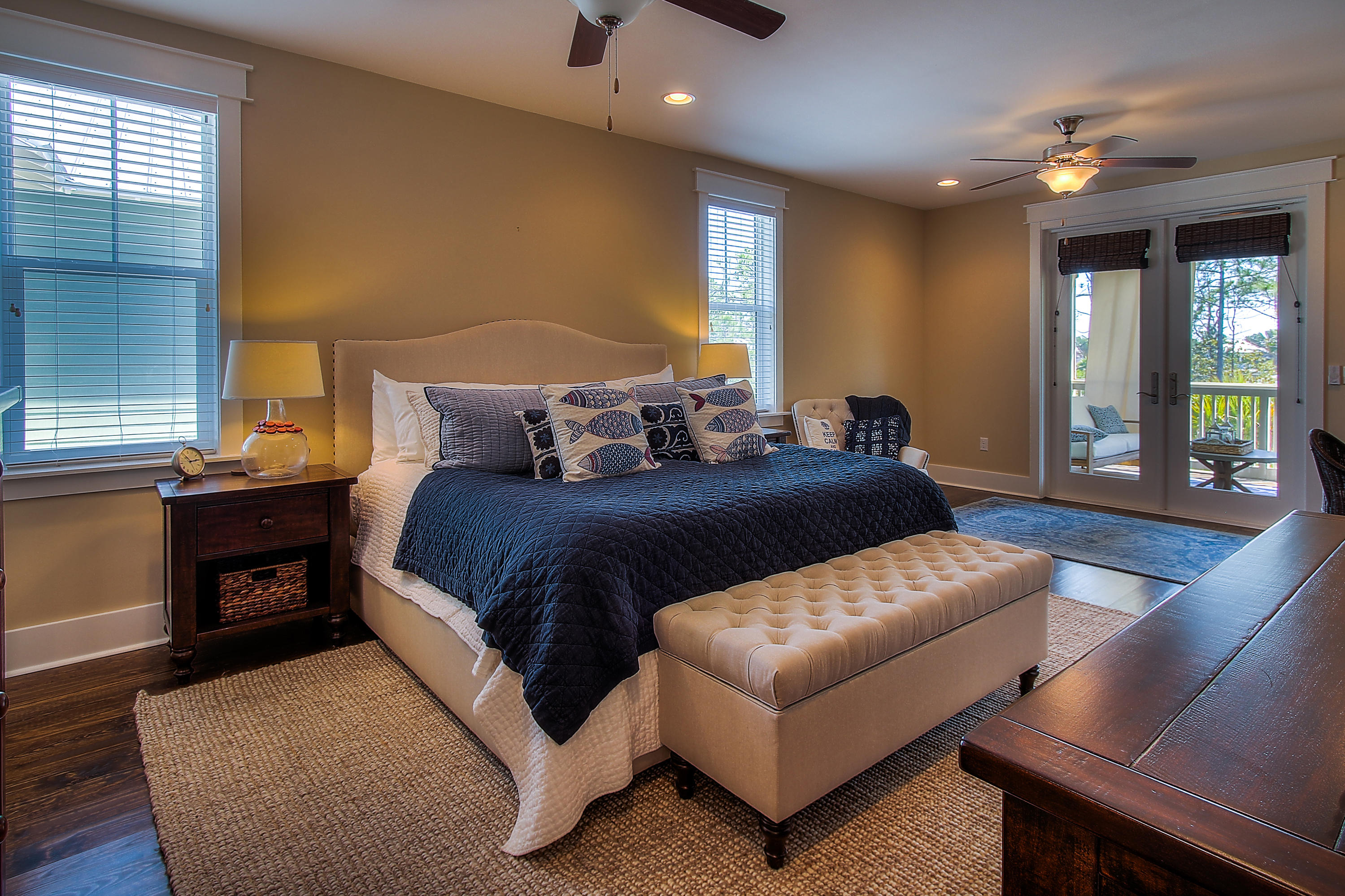 65 Flatwoods Forest Loop Santa Rosa Beach, FL 32459 - Photo 24 of 51 a bedroom with a large bed and a couch