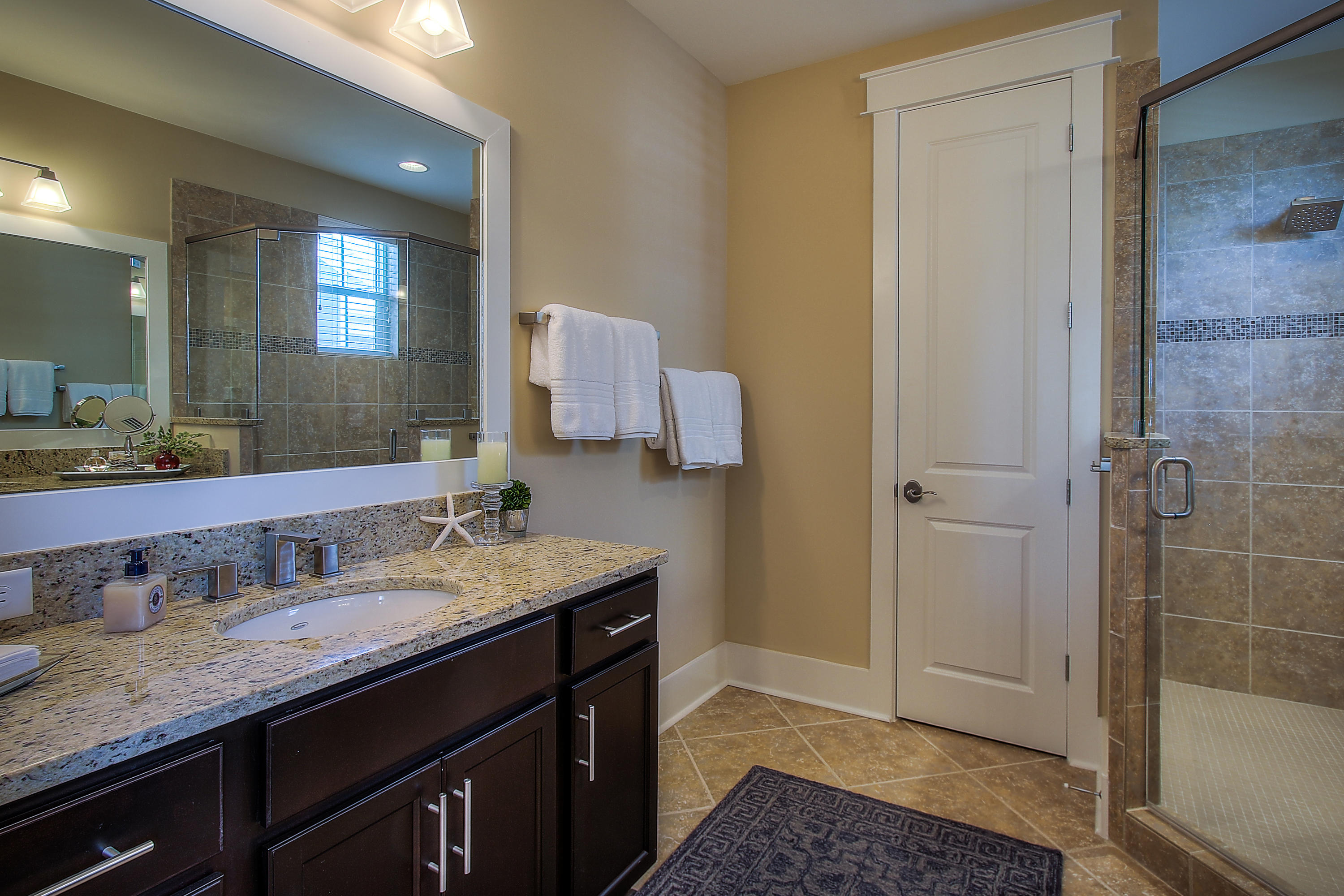 65 Flatwoods Forest Loop Santa Rosa Beach, FL 32459 - Photo 25 of 51 a bathroom with a granite countertop sink and a mirror
