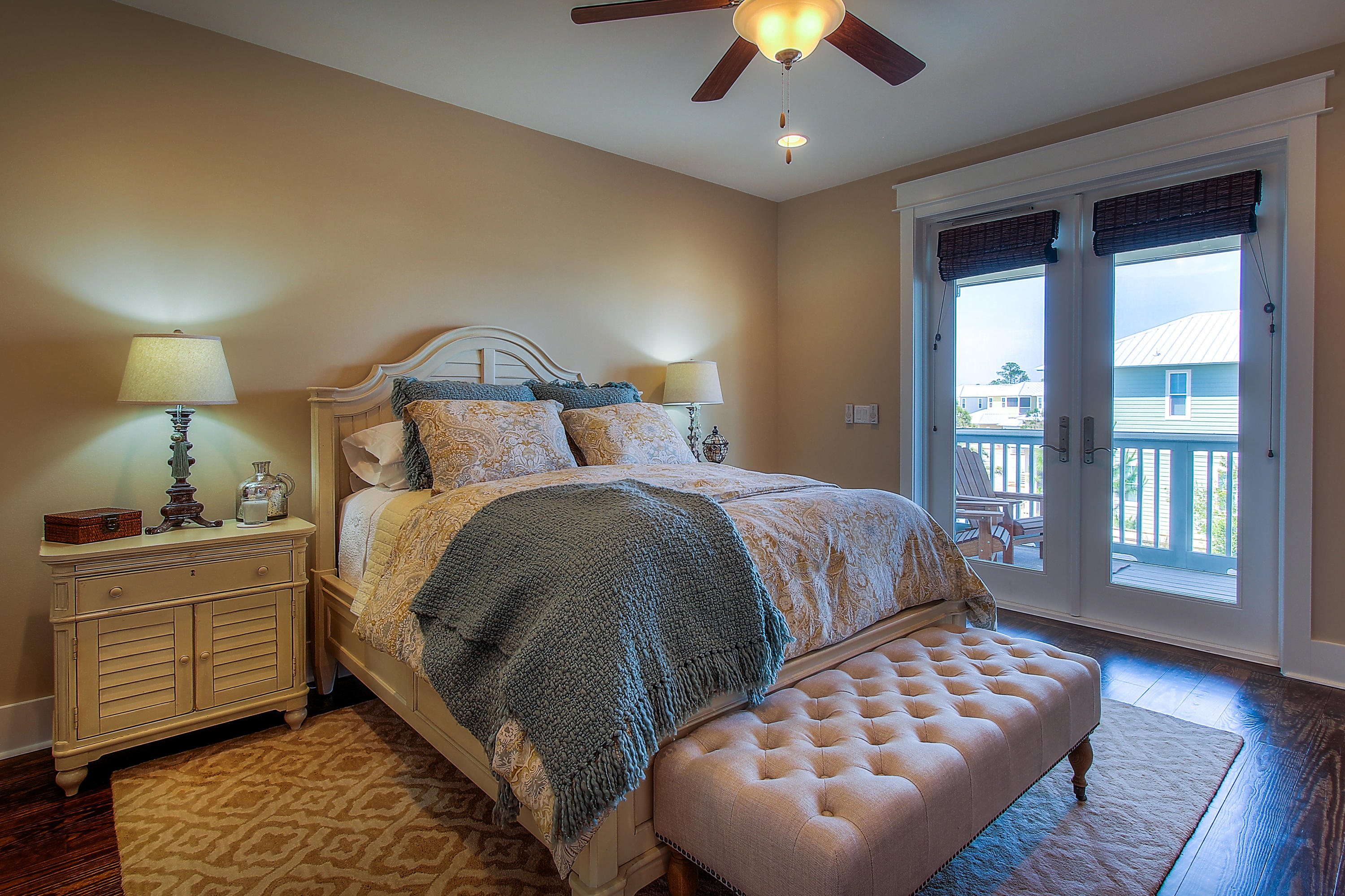 65 Flatwoods Forest Loop Santa Rosa Beach, FL 32459 - Photo 29 of 51 a bedroom with a bed and a lamp on dresser