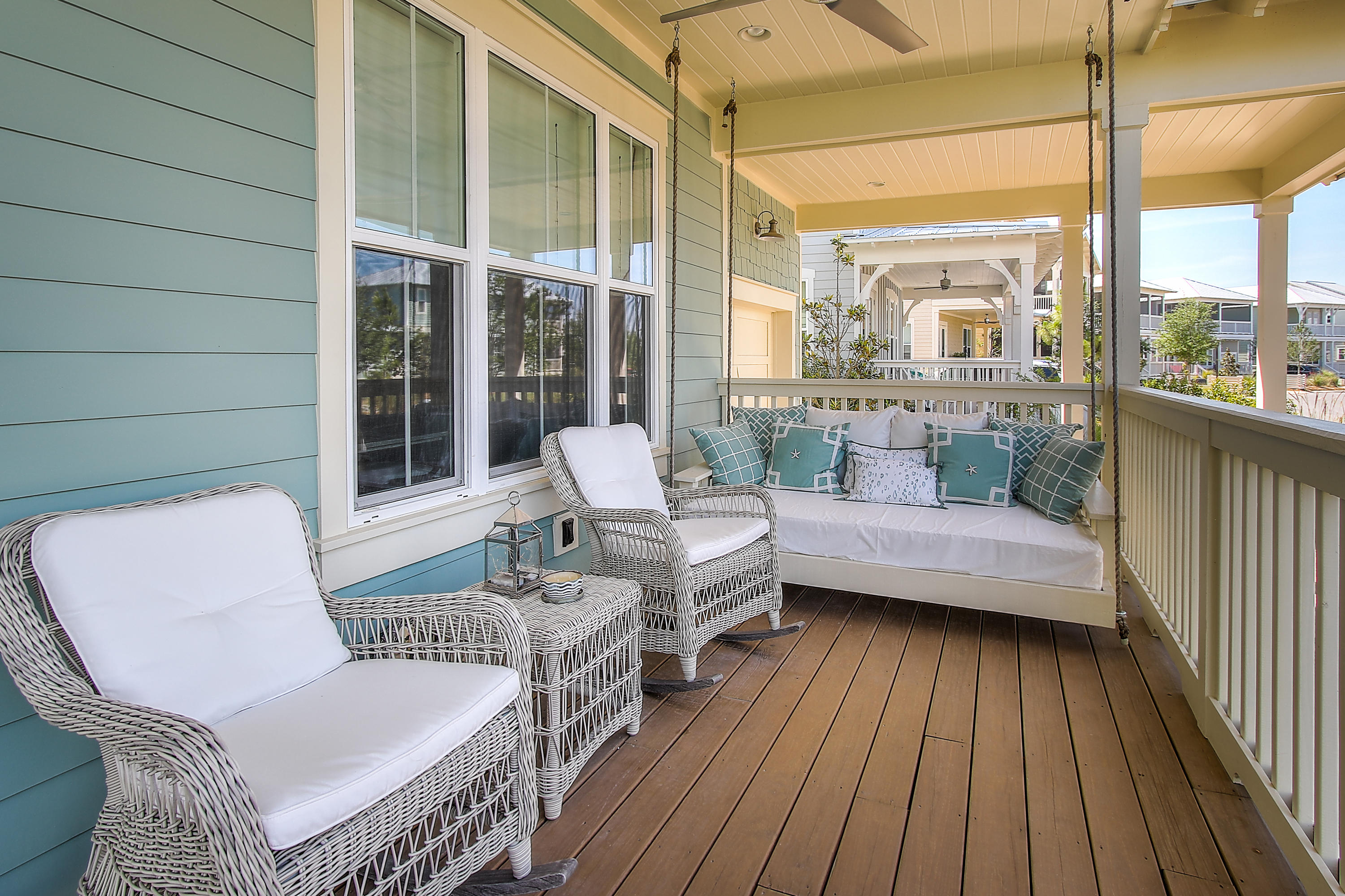 65 Flatwoods Forest Loop Santa Rosa Beach, FL 32459 - Photo 5 of 51 a balcony with furniture and wooden floor