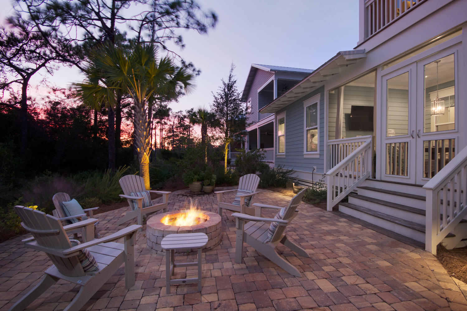 65 Flatwoods Forest Loop Santa Rosa Beach, FL 32459 - Photo 43 of 51 a view of a patio with chairs and a fire pit