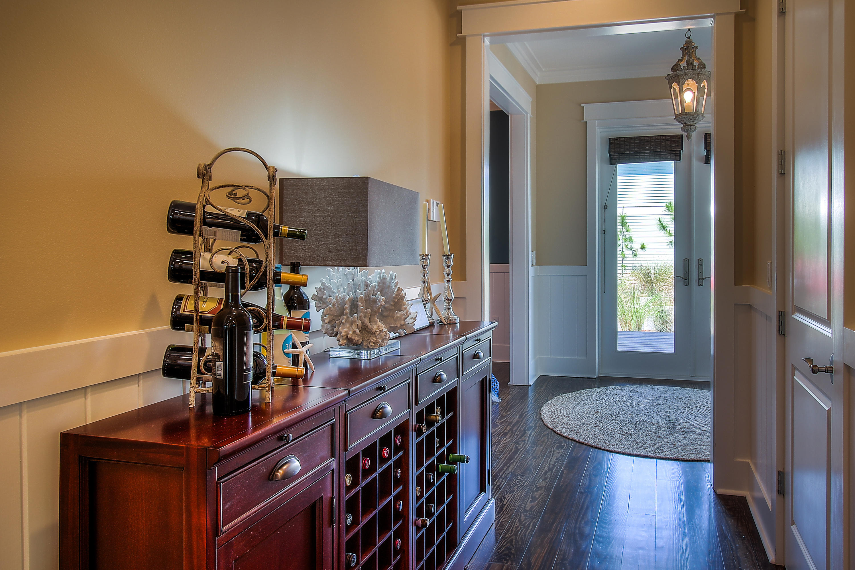 65 Flatwoods Forest Loop Santa Rosa Beach, FL 32459 - Photo 7 of 51 a room with two chandeliers and furniture
