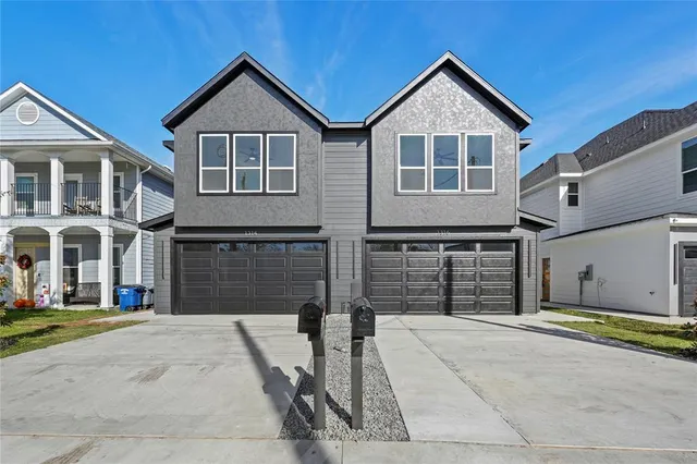 a front view of a house with a garage