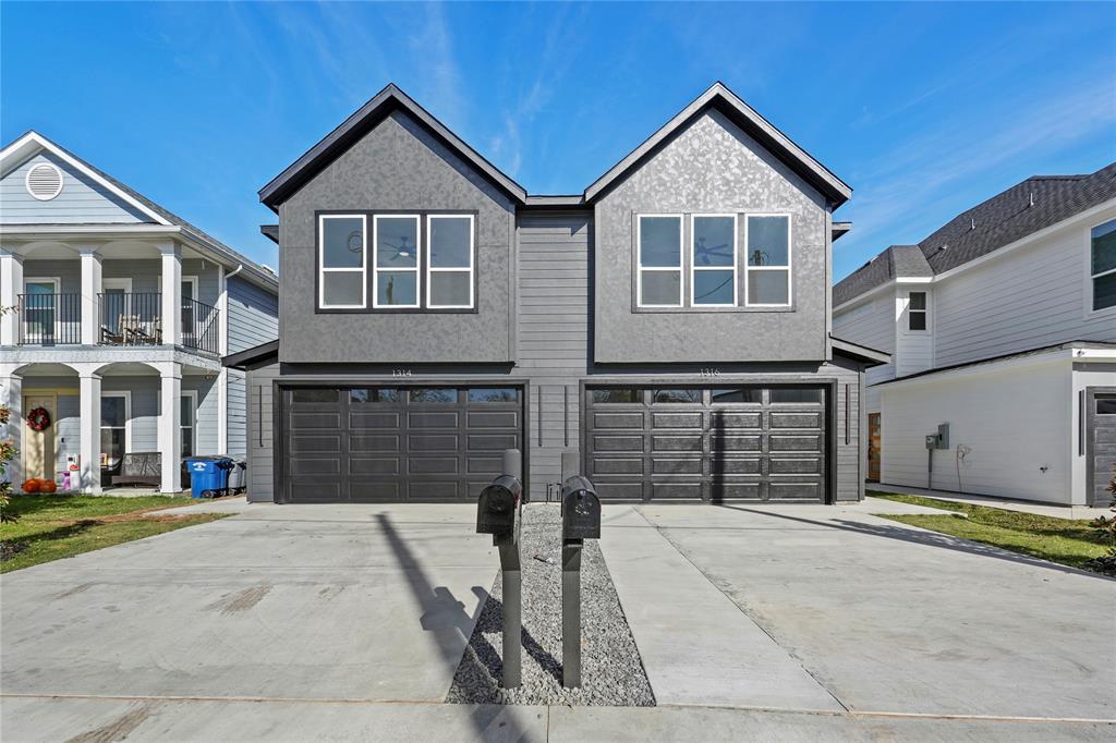 a front view of a house with a garage