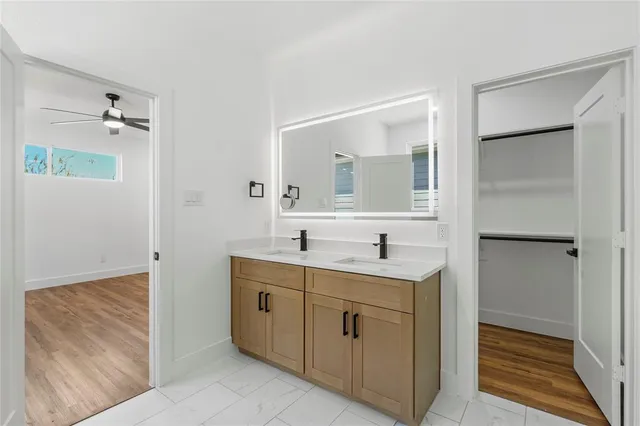 a bathroom with a sink a mirror and a toilet