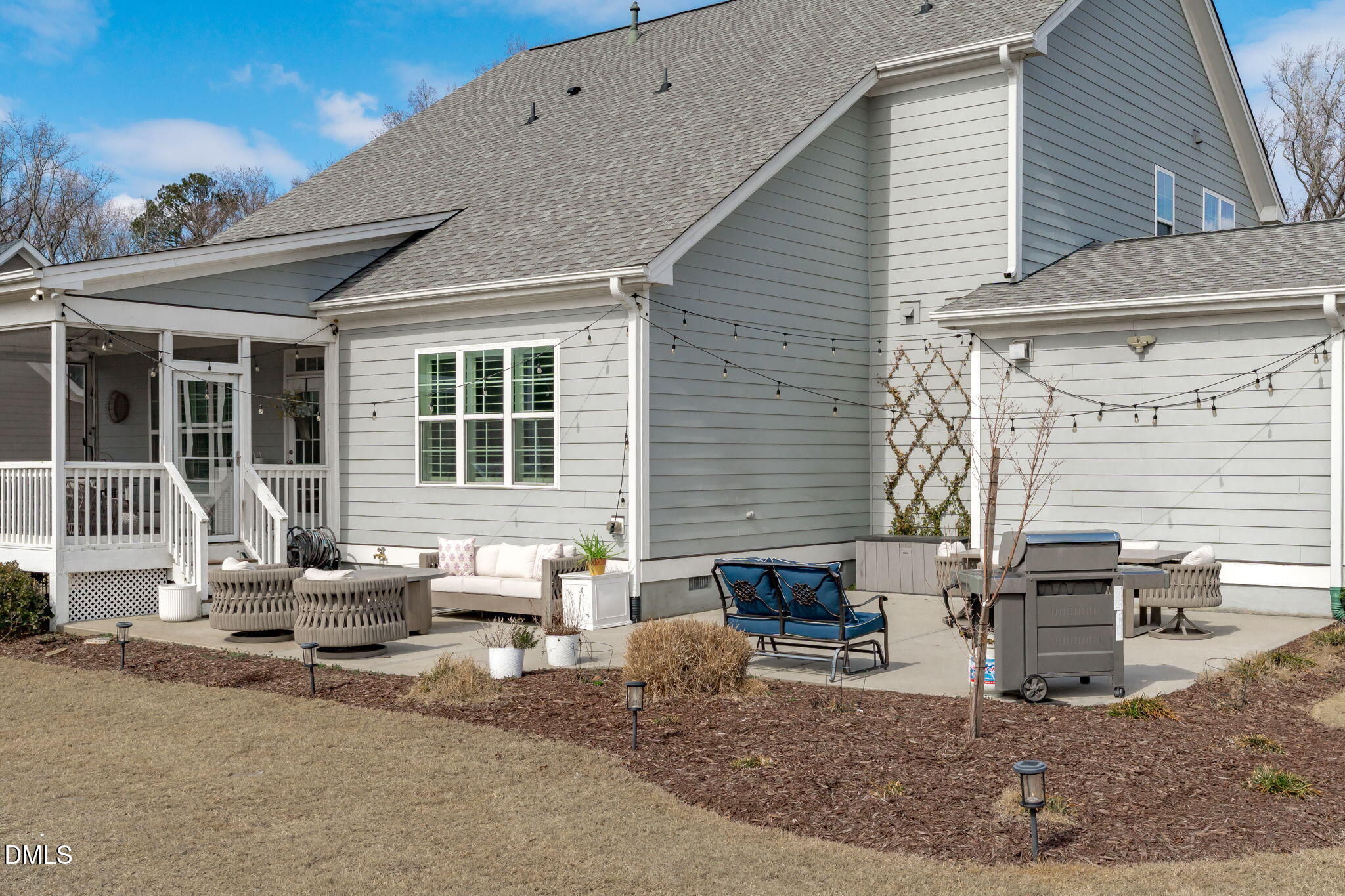 4144 Olde Judd Drive Willow Spring, NC 27592 - Photo 2 of 52 a building outdoor space with patio furniture and potted plants