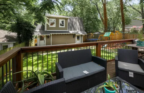 a view of a chairs and table on the deck