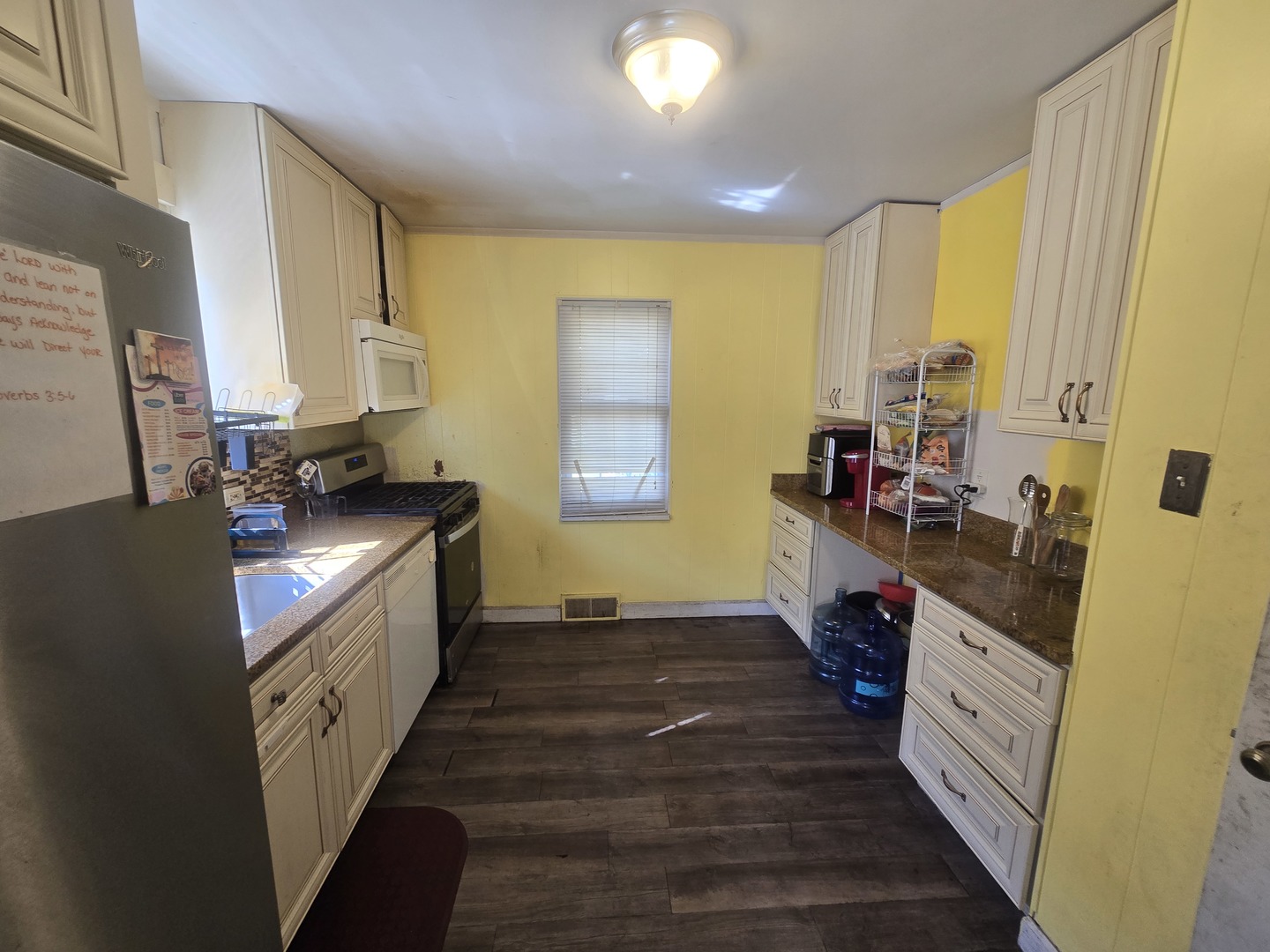 566 Hirsch Avenue Calumet City, IL 60409 - Photo 11 of 29 a kitchen with stainless steel appliances granite countertop a stove a sink and a refrigerator