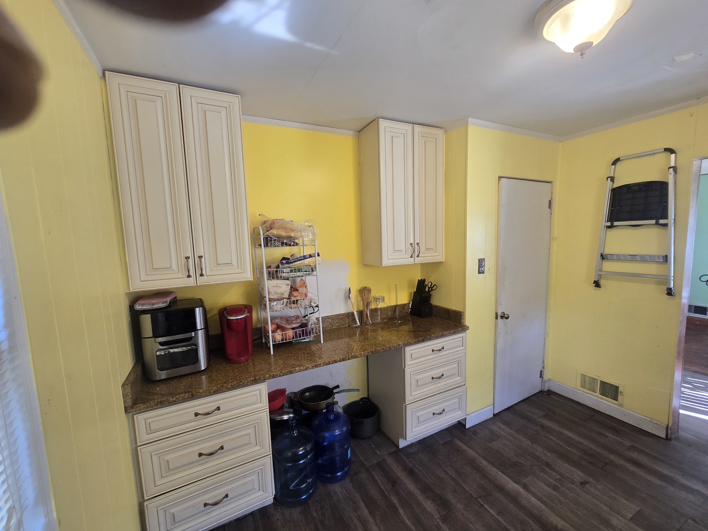 566 Hirsch Avenue Calumet City, IL 60409 - Photo 12 of 29 a kitchen with stainless steel appliances granite countertop a stove a sink and a refrigerator with wooden floor