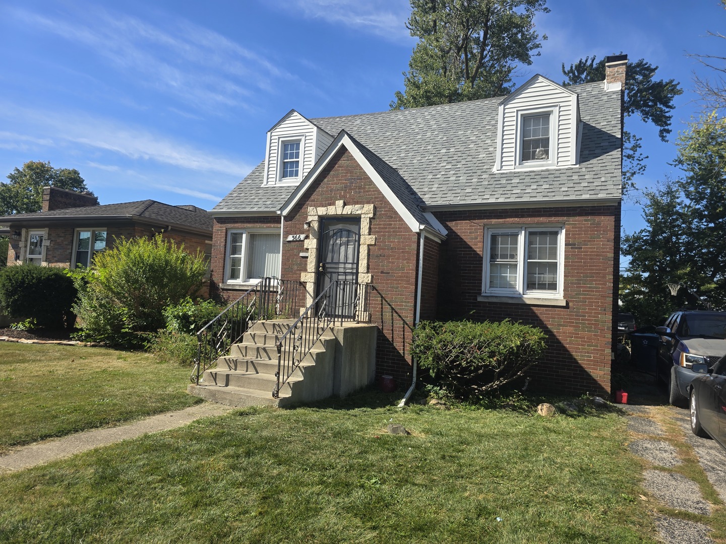 566 Hirsch Avenue Calumet City, IL 60409 - Photo 2 of 29 a front view of a house with a garden