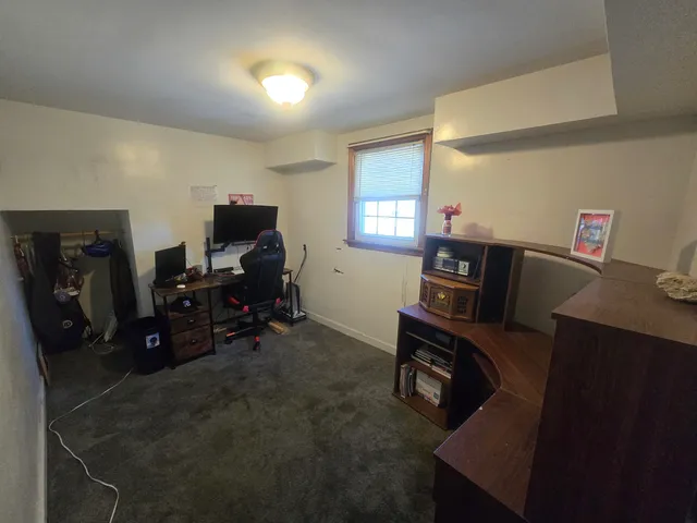 a view of a workspace with furniture