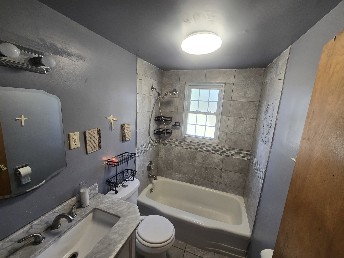 566 Hirsch Avenue Calumet City, IL 60409 - Photo 23 of 29 a bathroom with a bathtub shower sink vanity mirror and toilet