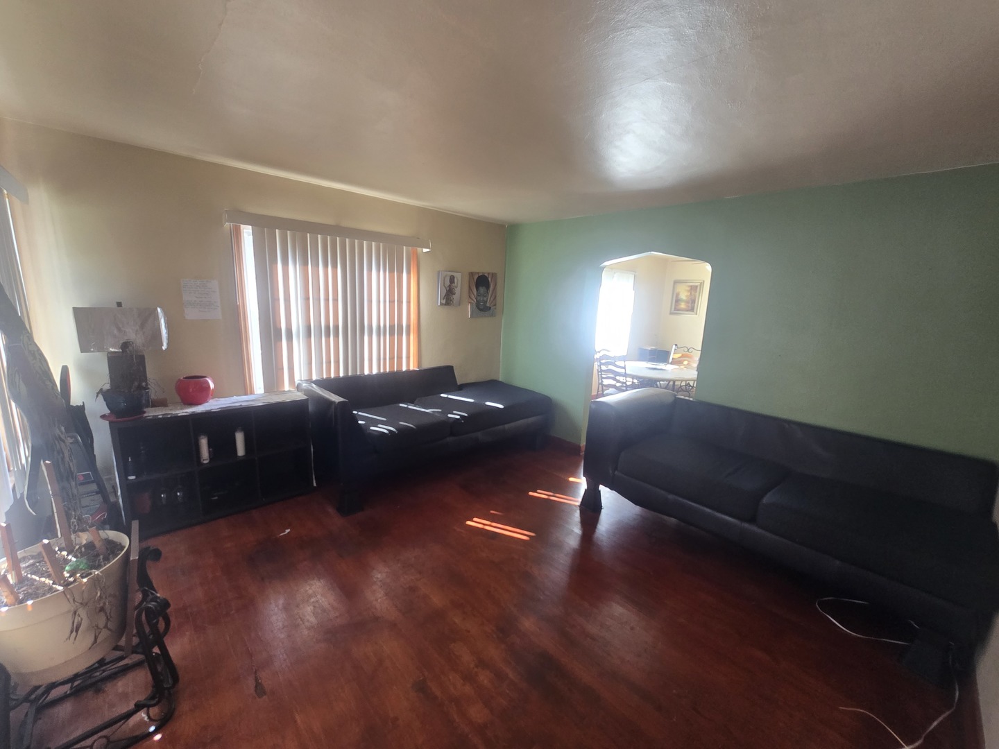 566 Hirsch Avenue Calumet City, IL 60409 - Photo 3 of 29 a bed room with a bed and a chair