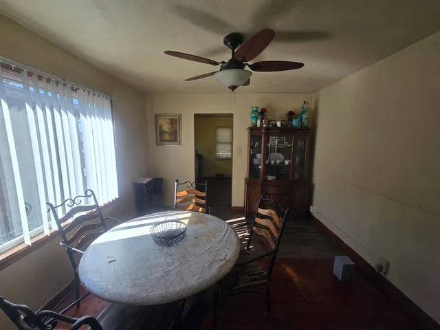 a view of a dining room with furniture and window