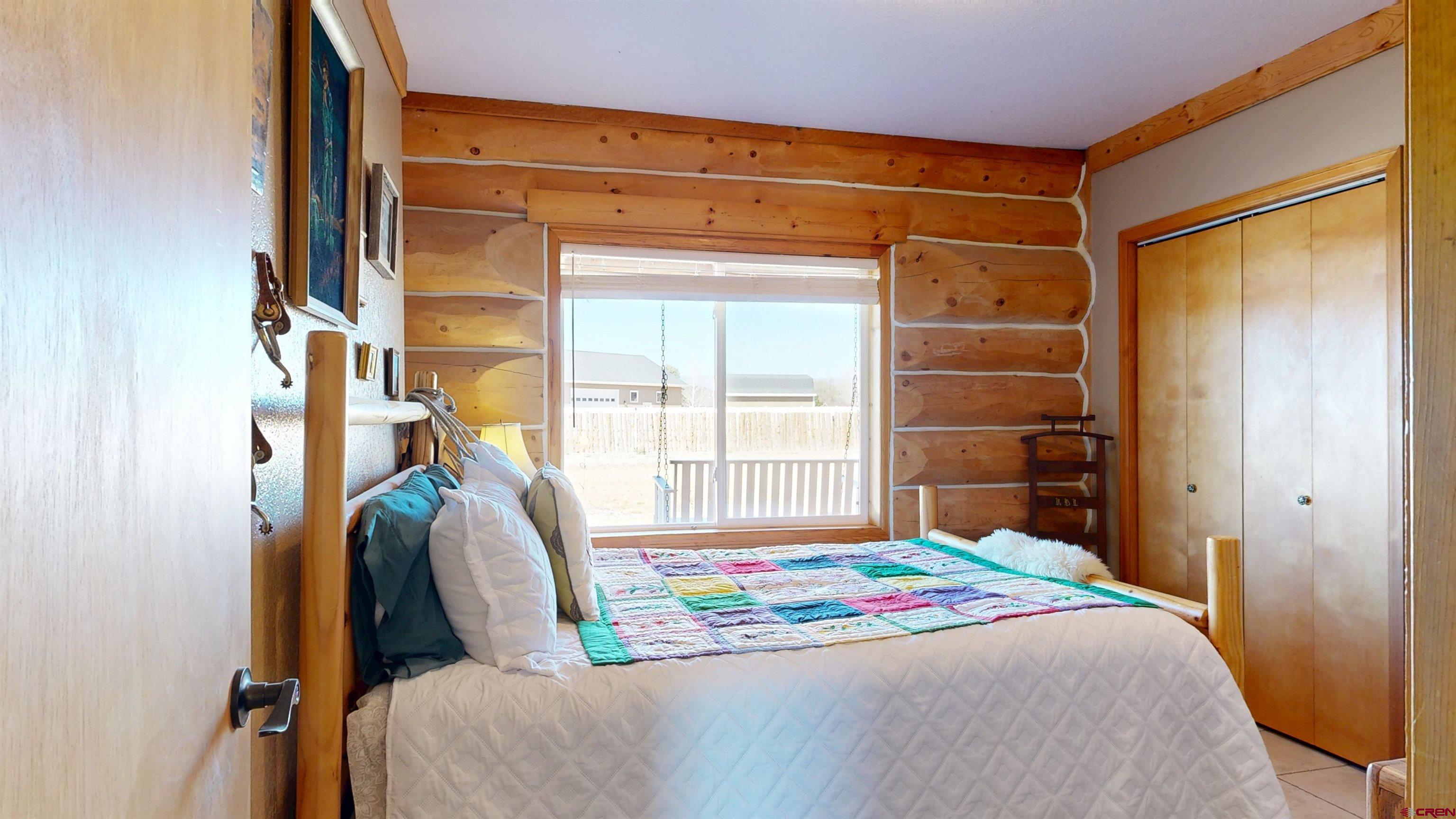 2083 Pioneer Road Delta, CO 81416 - Photo 16 of 45 a bedroom with a bed and a window