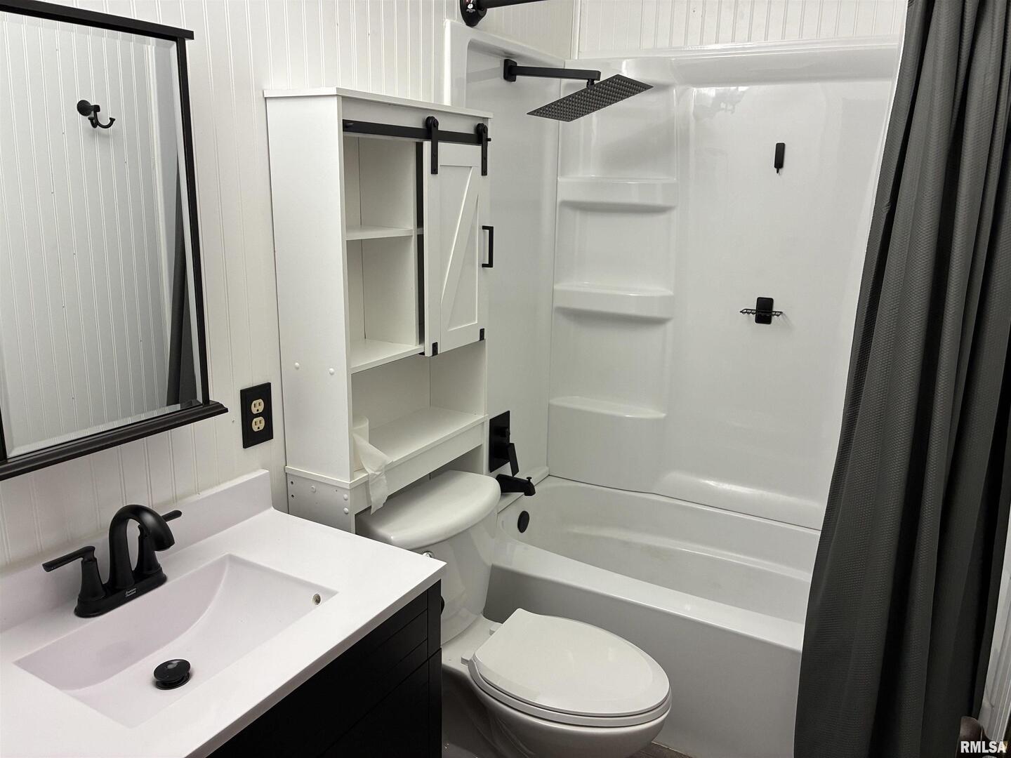 422 45th Street Moline, IL 61265 - Photo 10 of 22 a bathroom with a sink a toilet and shower
