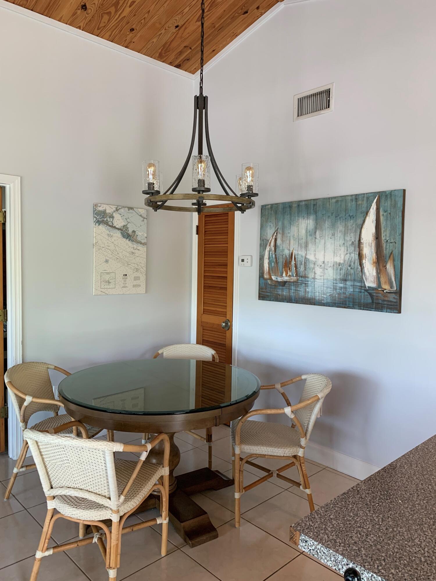 112 Captains Court Tavernier, FL 33070 - Photo 11 of 41 a dining room with chandelier