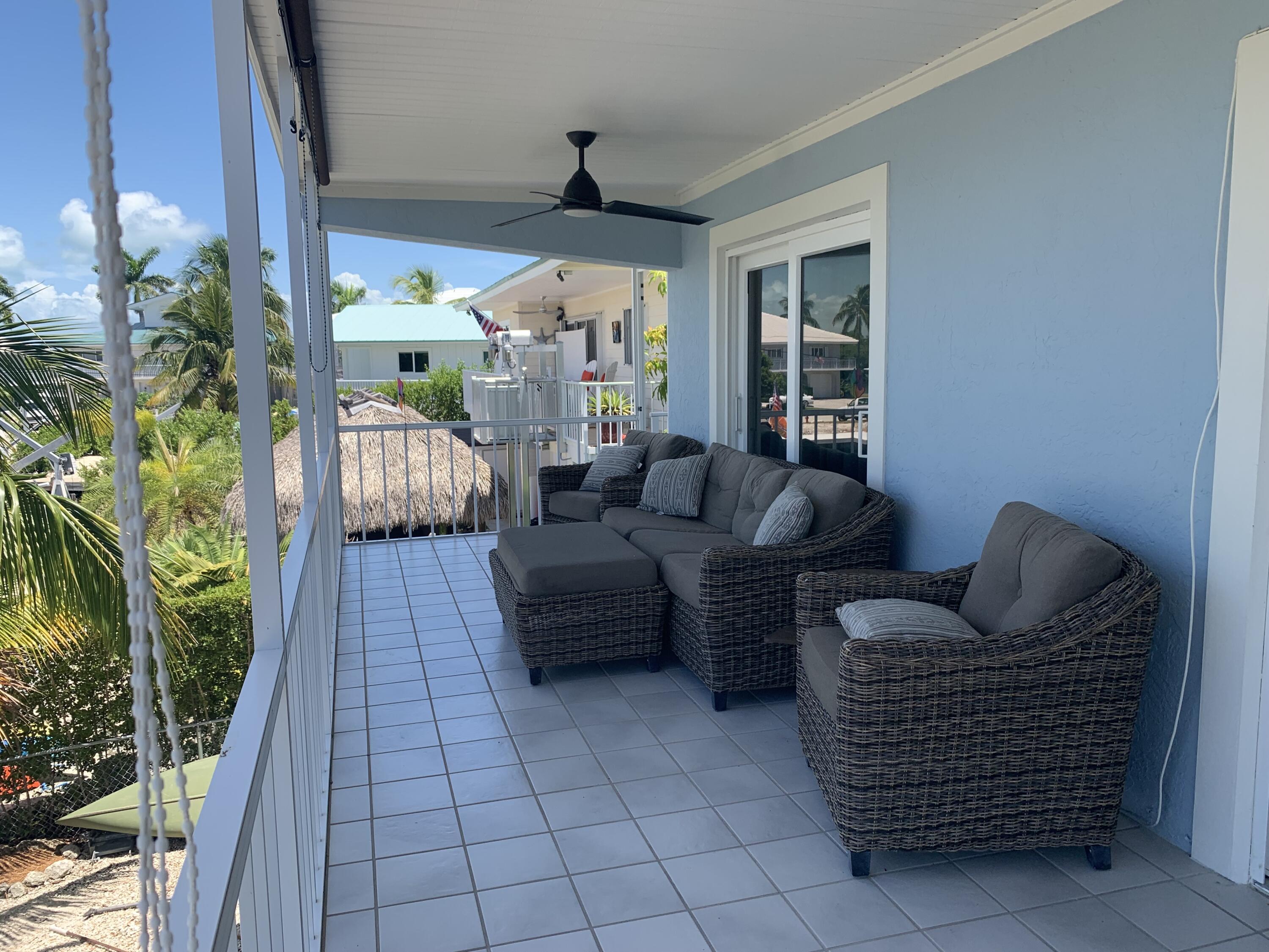 112 Captains Court Tavernier, FL 33070 - Photo 16 of 41 a living room with furniture and a large window
