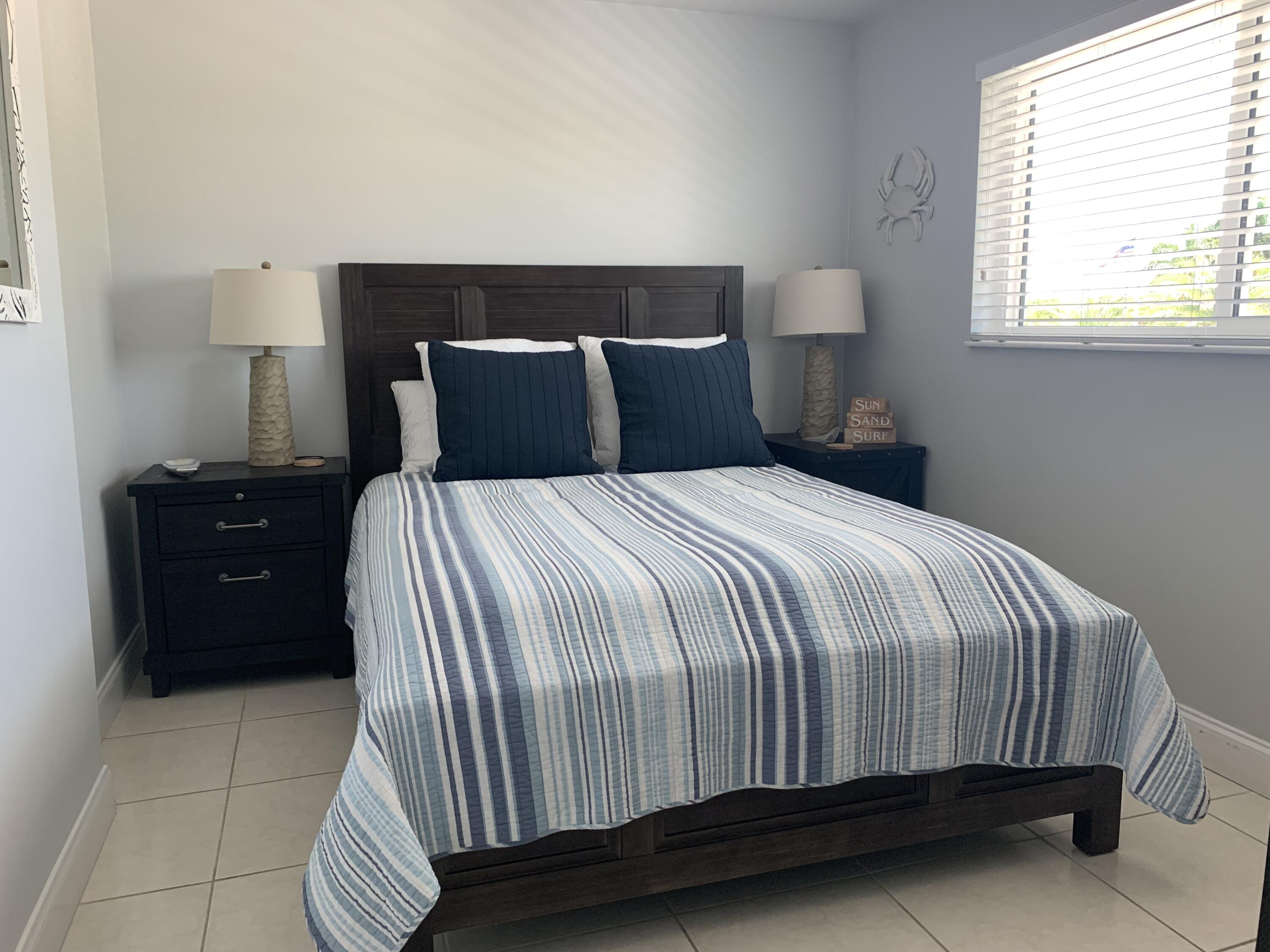 112 Captains Court Tavernier, FL 33070 - Photo 20 of 41 a bedroom with a bed and window