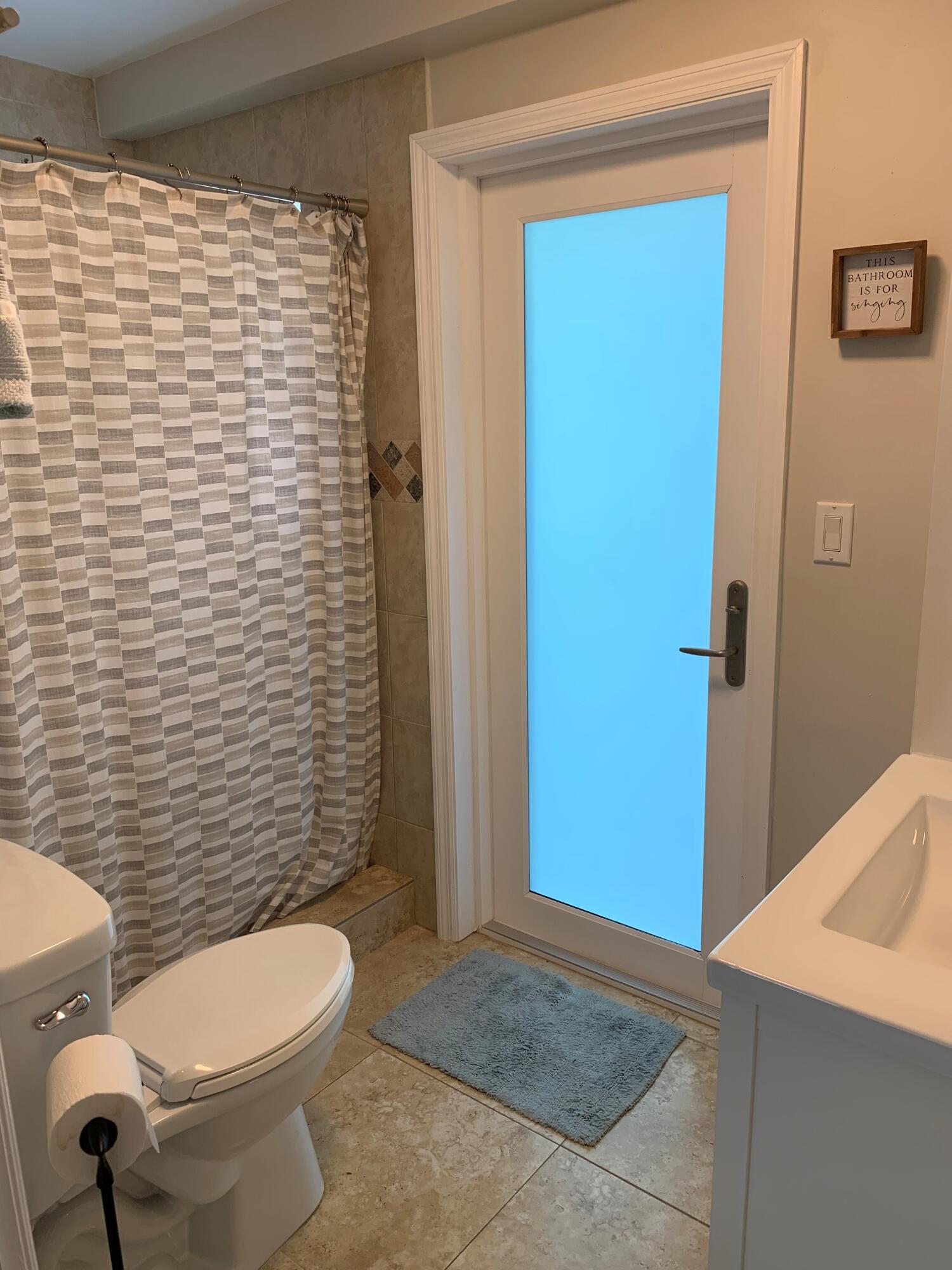 112 Captains Court Tavernier, FL 33070 - Photo 29 of 41 a bathroom with a toilet and shower