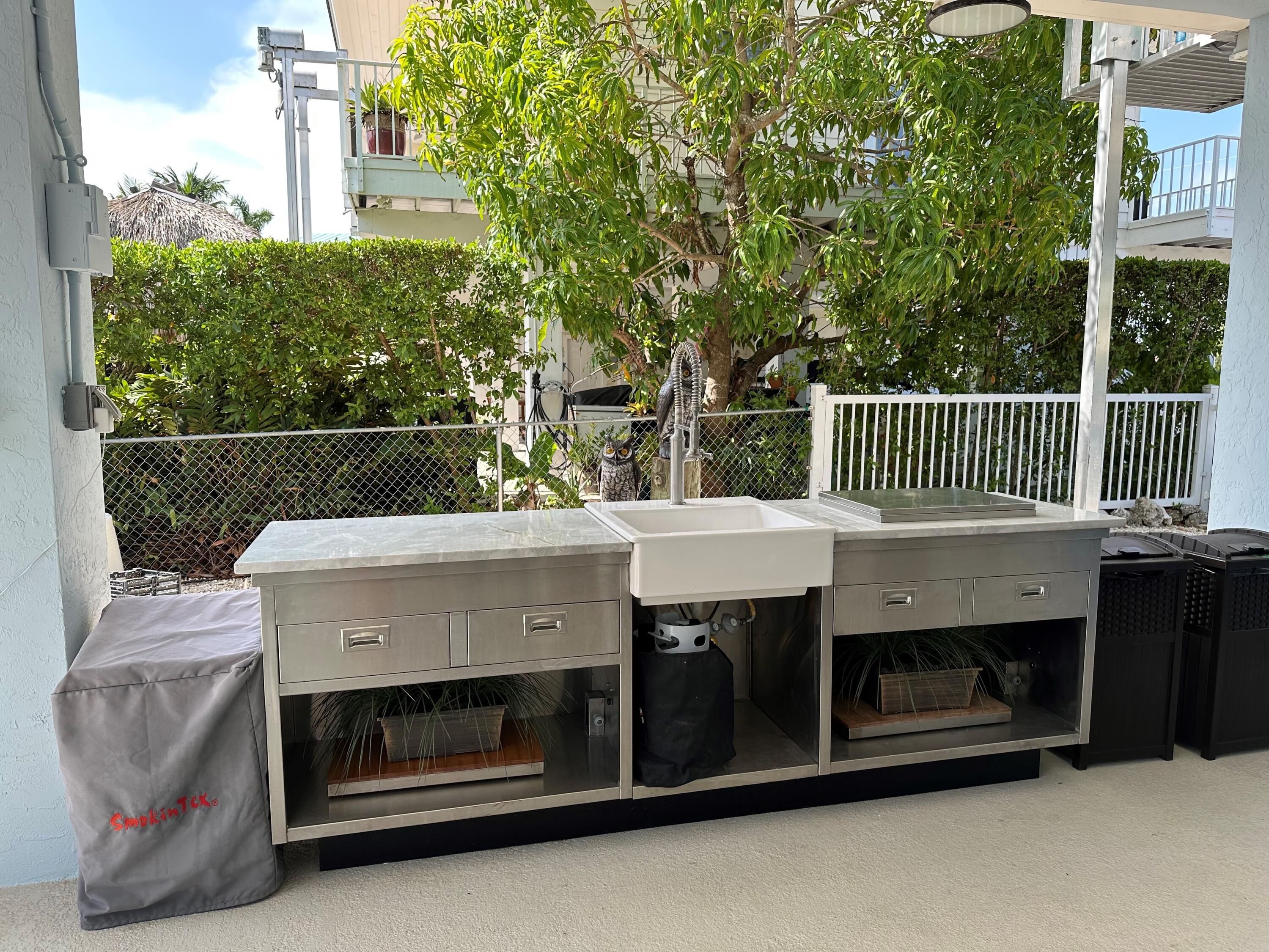 112 Captains Court Tavernier, FL 33070 - Photo 33 of 41 a view of a deck with a fireplace