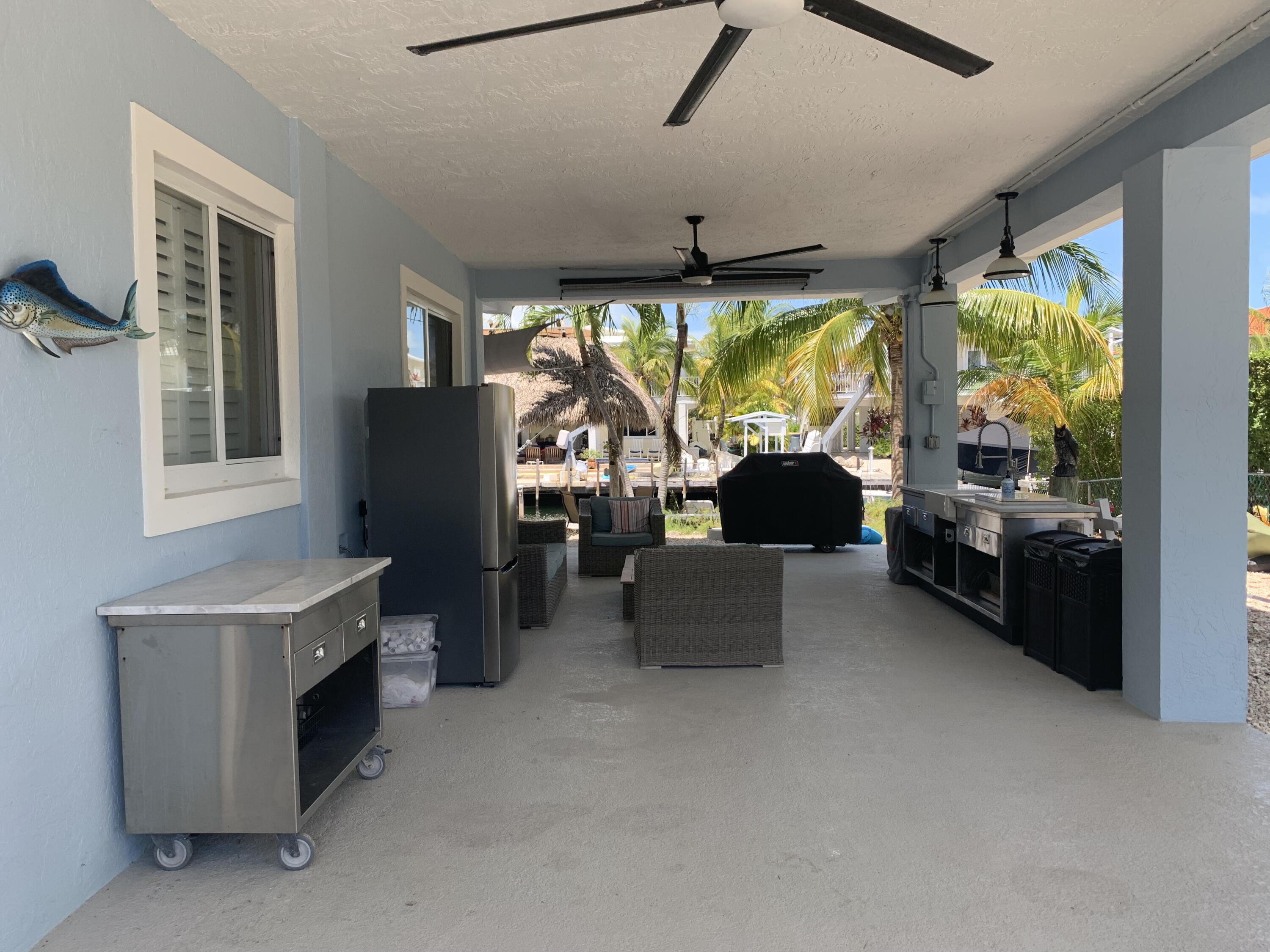 112 Captains Court Tavernier, FL 33070 - Photo 34 of 41 a living room with furniture and a large window
