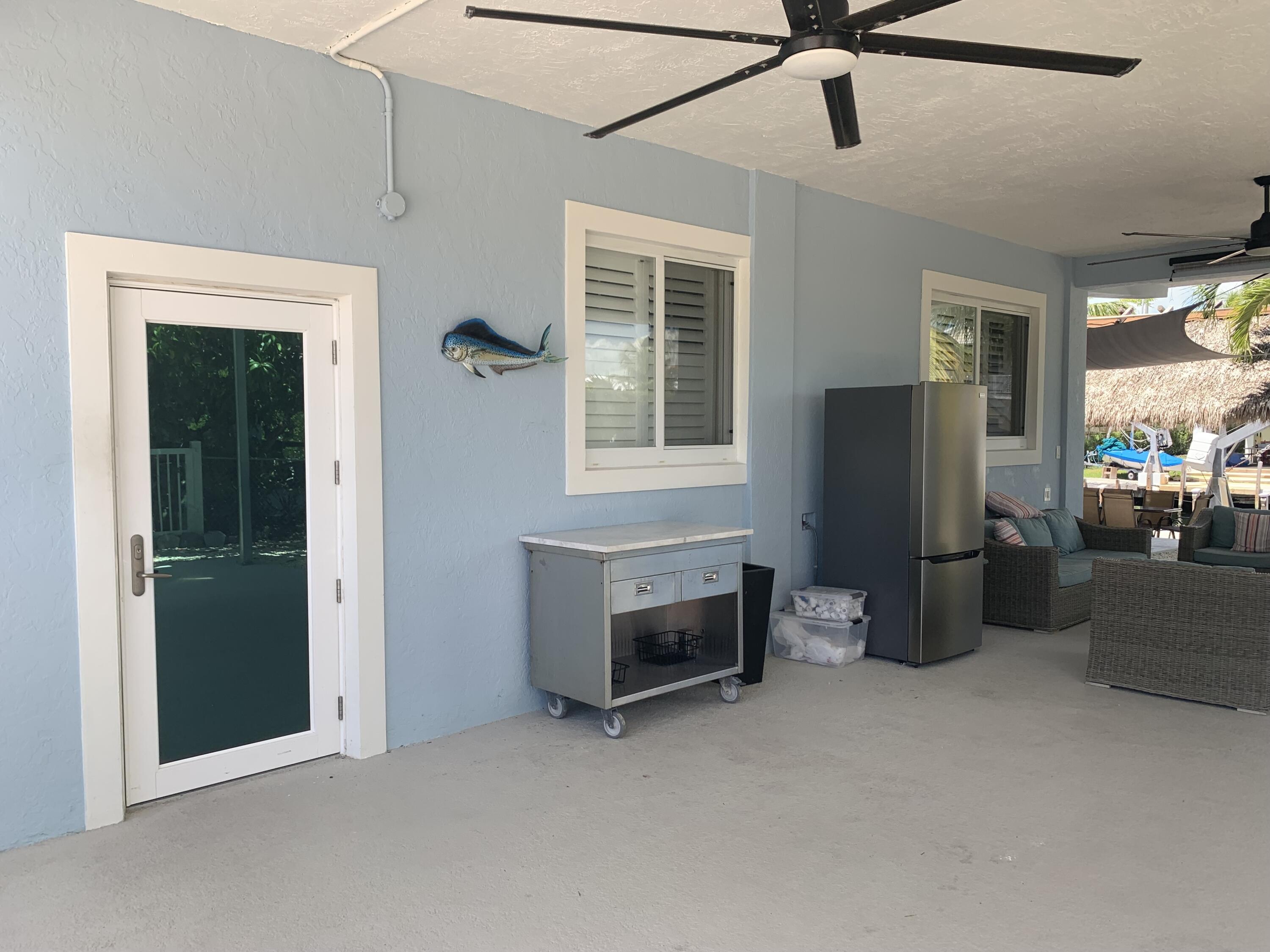 112 Captains Court Tavernier, FL 33070 - Photo 35 of 41 a room with furniture and a fireplace