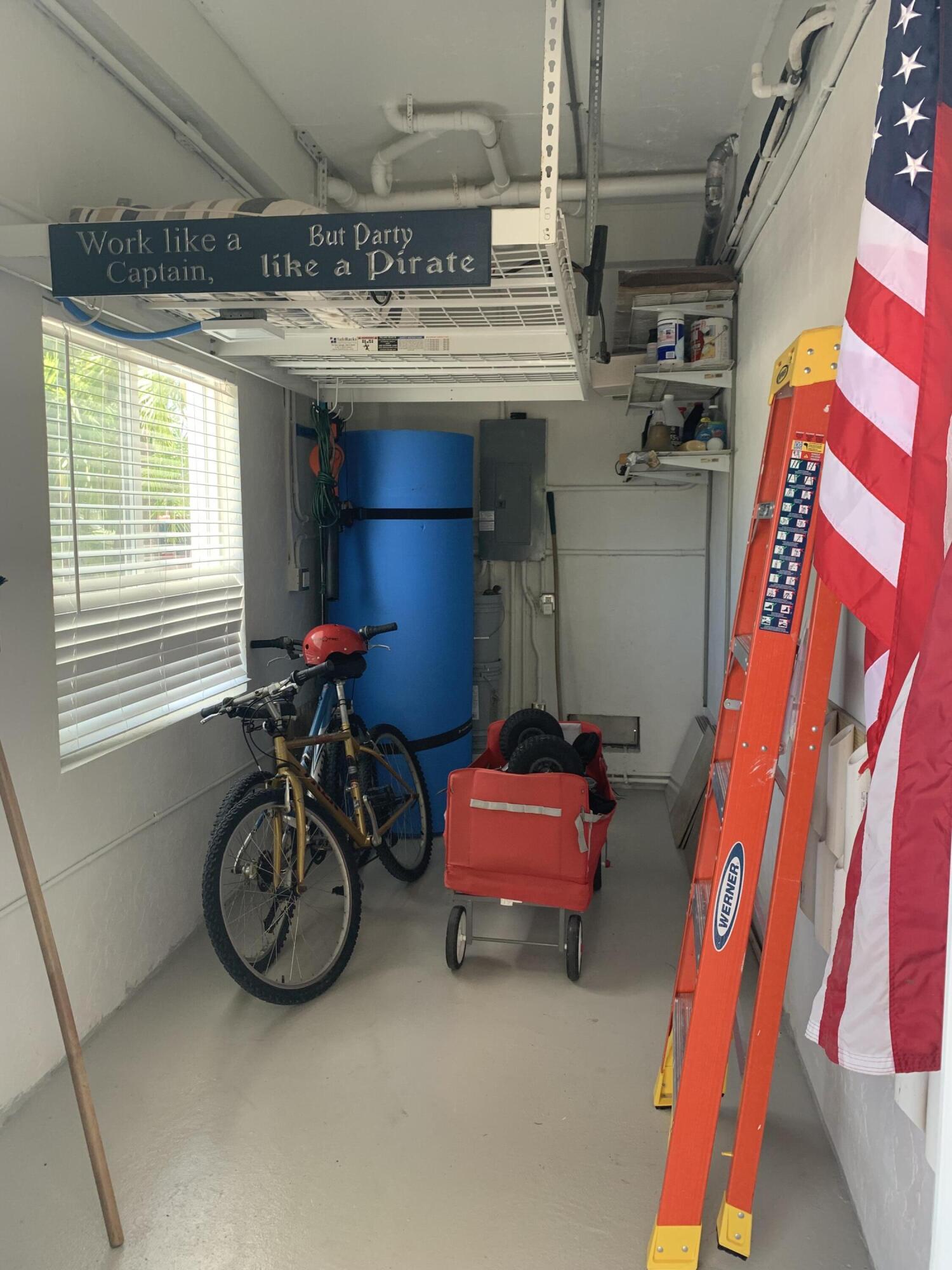 112 Captains Court Tavernier, FL 33070 - Photo 36 of 41 a room with furniture and a chandelier