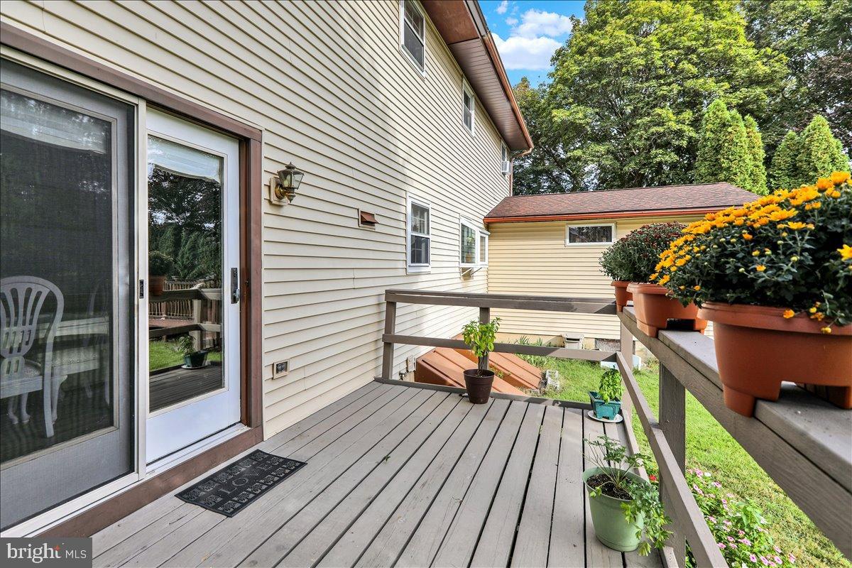 226 West Ruth Avenue Robesonia, PA 19551 - Photo 31 of 32 Charming deck with vibrant flower pots.
