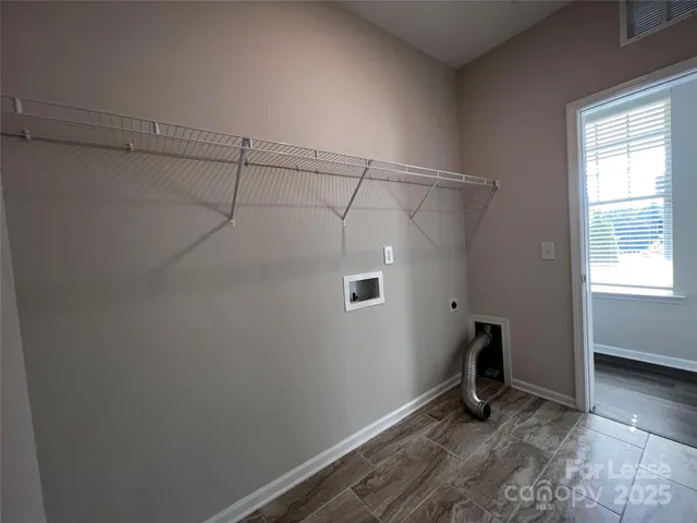 a view of a room with racks on the wall