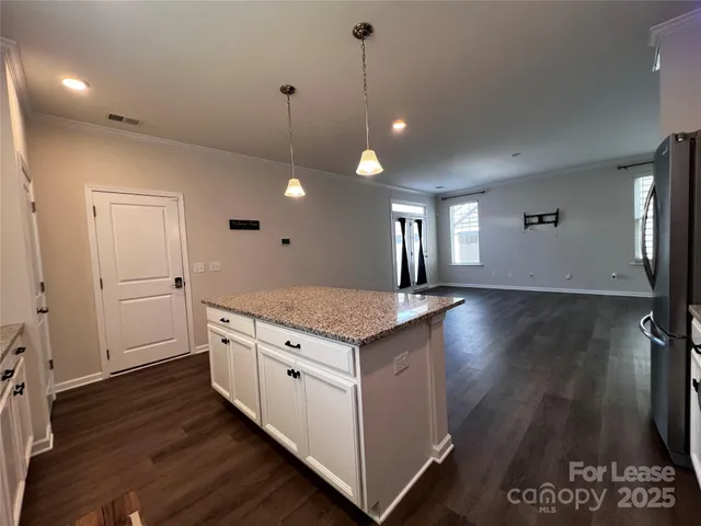 a kitchen that has a lot of cabinets in it