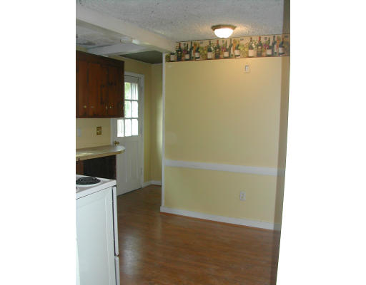 8 Austin Road Billerica, MA 01821 - Photo 4 of 13 a view of a hallway with wooden floor